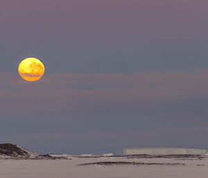 Bright full moon over the sea ice