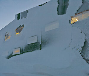 Snow covering the entire wall of the living quarters