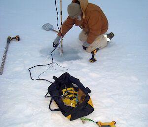 Expeditioner on the sea ice with installation gear