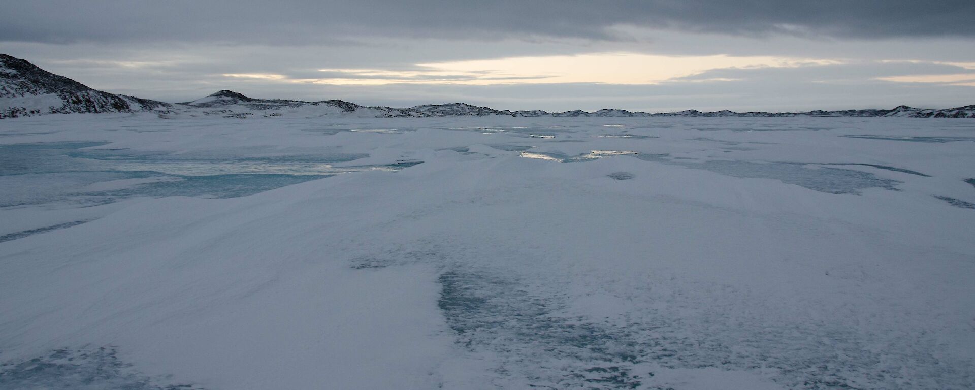 Sea ice with lumpy snow making riding difficult