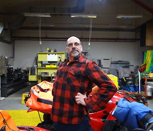 Expeditioner posing in front of a quad bike