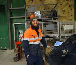 Expeditioner with his laptop in the warehouse