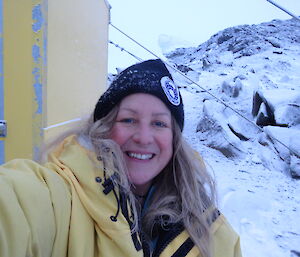 Close up photo of female expeditioner sovered in light layer of snow