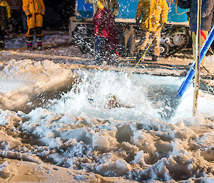 expeditioner in the water partially hiden by white water