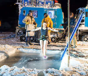 Expeditioner enters water with a safety jump