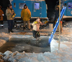 Expeditioner looks like he is flying out of the icy waters