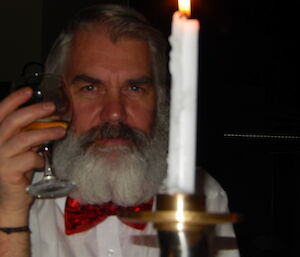 Close up photo of male expeditioners face, with grey and black beard