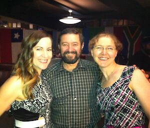 Three expeditioners at formal function looking towards camera