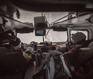 Two expeditioners in the front cabin of the hagglund