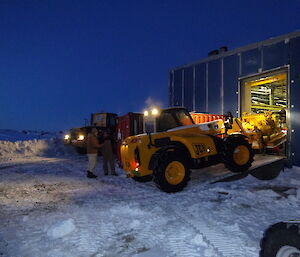 JCB relocating a heavy engine into power house through a side wall