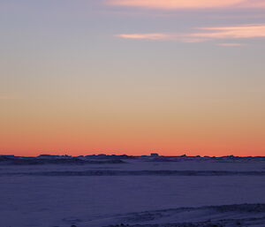 Stunning red orange sunset over the sea ice