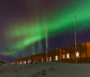 Green aurora above station buildings