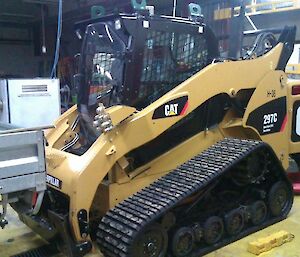 Yellow bobcat vehicle in the workshop