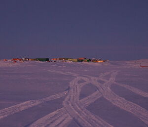 Numerous Hägglunds tracks on the sea ice leading back to station