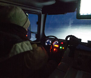 Expeditioner in the driver’s seat of the Hägglunds cabin