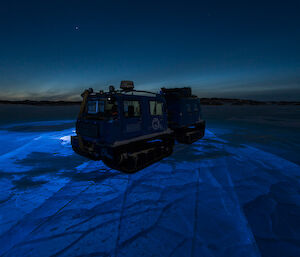 Lights under the ice give the frozen lake a beautiful glow