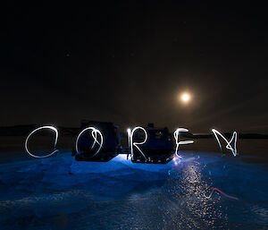 Using timelapse photography expeditioner writes his name using a torch