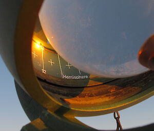 Large glass sphere recording sunlight hours