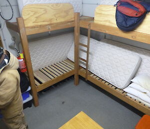 Mattresses on their sides on all the bunk beds