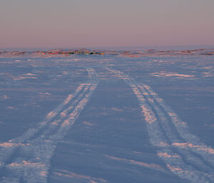 Track marks in the sea ice leading back to station