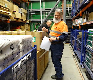 two expeditioners in the warehouse counting toilet paper for the annual stocktake
