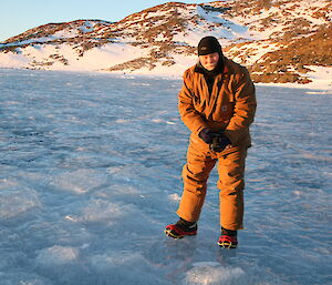 Expeditioner standing on a frozen lake