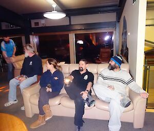 Expeditioners sitting on a lounge outside the cinema doors