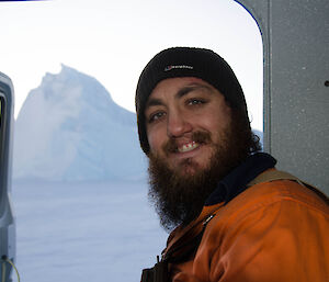 Close up photo of expeditioner sitting in a Hägglunds