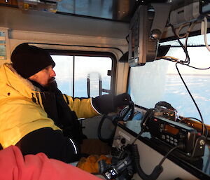 Expeditioner driving a hagglund, photo taken from inside the hagg