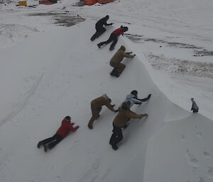 Expeditioner racing to get to the top of a steep icy hill