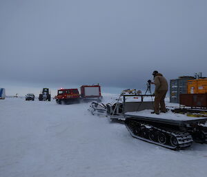 Expeditioner filming the arrival of the fire hagg from the back of a ute