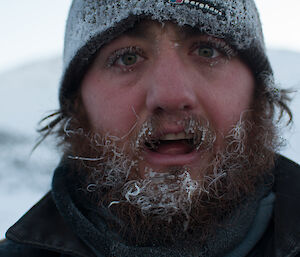 Close up photo of expeditioners and his frozen beard