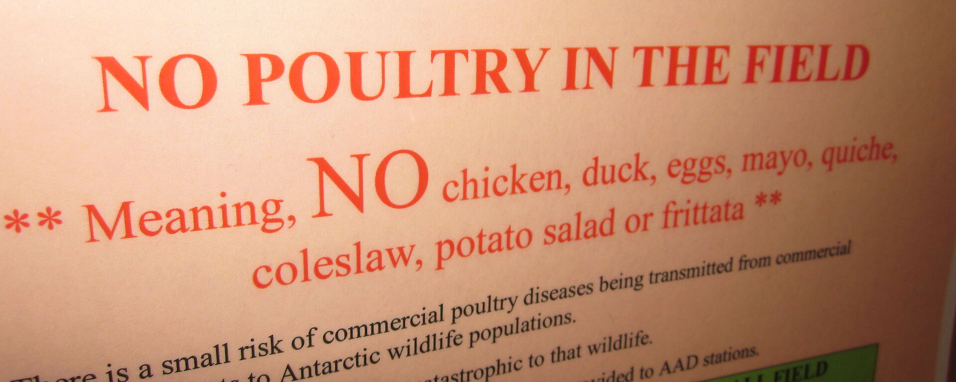 A sign saying no chicken products can be taken into the field