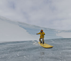 Expeditioner riding a frozen wave