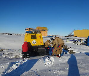 Four expeditioners blindfolded find shelter in the Hägglunds oversnow tracked vehicle
