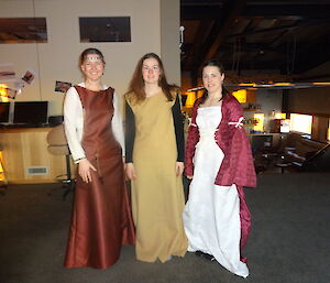 Three females dressed in medieval costume