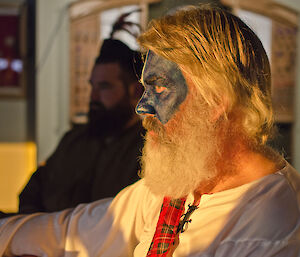 Expeditioner wearing scottish kilt and face painted blue and white