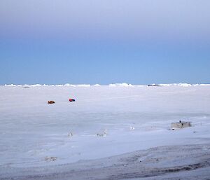 Two Hägglunds on the sea ice heading off station