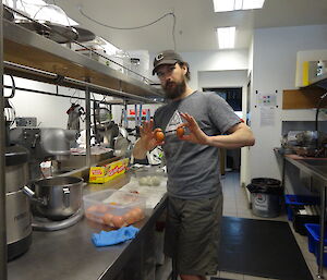 Expeditioner in the kitchen peeling eggs