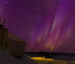 Purple aurora over station