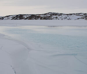 Salt water lying on top of frozen fjord