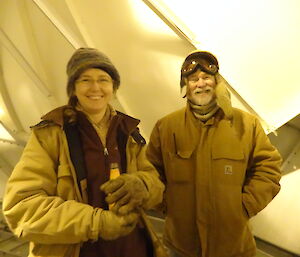 Two expeditioners having a beer in a large dome
