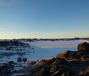 View from Bandits Hut over the sea ice and a blue Hägglunds
