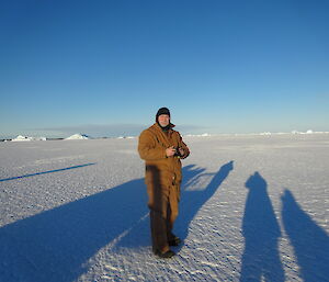 Expeditioner standing on the sea ice