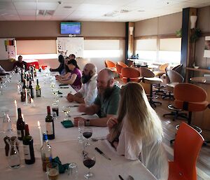 20 expeditioners seated at the large dining table