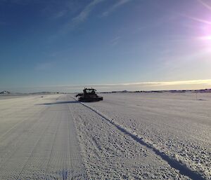 Snow groomer grooming the sea ice