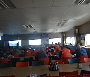 Small team of table spread out across 7 long tables