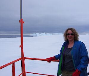 Lady posing in on deck of the icebreaking ship Aurora Australis