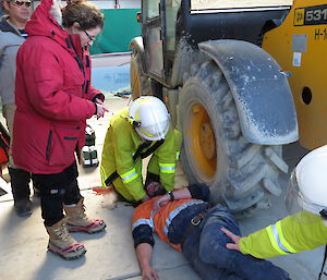 Expeditioners pretending to be injured lying down awaiting first aid by rescuers during a medical exercise