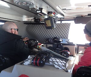 Expeditioner extraordinaire driving hagg with foam blocking windshield to simulate blizzard conditions